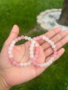 White glass beads with pink glass beads beaded bracelet Pink Round Crystal Bracelet Gift, Rose Quartz Beaded Bracelets As Gift, Pink Crystal Bracelet Gift, Pink Gemstone Beads Jewelry, Pink Round Rosary Bracelet Gift, Pink Rose Quartz Round Stretch Bracelet, Pink Rose Quartz Stretch Bracelet, Pink Spiritual Crystal Bracelet With Faceted Beads, Pink Gemstone Beads Bracelets For Healing