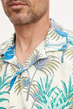 Hello vacation! A warm weather essential is the classic camp shirt and this is our take on this casual button down in a bold print that is just the right amount of eye-catching. A relaxed fit in a cotton woven. Casual Collared Hawaiian Shirt For Beach, Green Printed Camp Shirt For Spring, Summer Collared Camp Shirt With Palm Tree Print, Collared Camp Shirt With Palm Tree Print For Summer, Spring Printed Green Camp Shirt, Printed Camp Collar Shirt For Beach Season, Printed Button-up Camp Shirt For Beach, Summer Camp Shirt With Palm Tree Print And Collar, Summer Button-up Camp Shirt For Beach Season