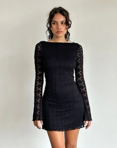 In a black regal lace, the Sevila dress features a mini, bodycon silhouette with long, flared sleeves and a boat neckline. Complete with scalloped hem detailing on a fully lined body. Lace Short Dress, Knitted Lace, Short Lace Dress, Clothing Trends, Lace Short, Plain Style, Lace Dress Black, Trends 2024, Boat Neckline