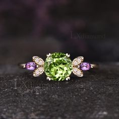 Item description ✦ Handmade item! ✦ Material: 925 sterling silver, Solid 10k/14K/18K GOLD (can be made in white/rose/yellow gold) Engagement ring ✦ Center stone: Natural Peridot ✦ Size/Weight: 7mm Round Cut ✦ Side stones: 2x4mm Marquise Cut Natural Amethyst and Round Cut Moissanites Any ring size can be made,if the ring size is not in the option list ,contact me. As it is handmade,it needs 2-4 weeks to finish and then be shipped by usps or DHL. Return policy: We offer 30 days return policy. For Green Diamond Gemstones For Anniversary, Anniversary Peridot Birthstone Ring With Gemstone, Green Sterling Silver Amethyst Ring For Wedding, Green Amethyst Rings In Fine Jewelry Style, Anniversary Peridot Birthstone Rings, Peridot Gemstones For Anniversary - May Birthstone, Peridot Gemstones For Anniversary, May Birthstone, Peridot Gemstones Birthstone For Anniversary, Peridot Birthstone Gemstones For Anniversary