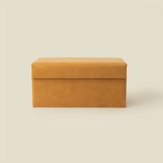 a brown box sitting on top of a white surface