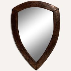 a mirror that is shaped like a shield