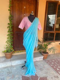 Pink blue mirror sequin saree | silk saree with blouse | designer modern party sequin saree | simple saree blouse | mirror work blouse | sarees USA | blue georgette saree with  blouse           so bored of regular saree styles ? Then You really deserve to own this unique stylish saree look for your upcoming occassion that really makes you stand apart in crowd !!            You dont really need to stress your self in finding matching blouses for our sarees !! we pretty much carry our sarees with trendy stitched blouses or we will help you with our mix and match collection !!           Presenting this beautiful georgette saree in beautiful powder blue color with sequin all over as in the picture was paired up with our light pink  designer mirror hand embroidery blouse in modern V neck and el Diwali Mirror Work Pre-draped Tissue Silk Saree, Diwali Pre-draped Tissue Silk Saree With Mirror Work, Diwali Tissue Silk Pre-draped Saree With Mirror Work, Tissue Silk Blouse With Mirror Work For Reception, Diwali Chanderi Pre-draped Saree With Mirror Work, Bollywood Tissue Silk Blouse With Gota Work, Traditional Drape Blouse With Mirror Work In Tissue Silk, Bollywood Style Tissue Silk Blouse With Gota Work, Festive Chanderi Pre-draped Saree With Mirror Work