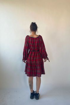 The mini josie dress is an elegant classic tiered dress that features an elastic waist and ethereal puff sleeves with bow tie cuffs providing a sophisticated silhouette without compromising comfort.    -  64% rayon 34% polyester 2% elastane  - slips on over head  - made in canada Central St Martins, Mini Dress Red, Denim Hat, Kids Outerwear, Plaid Shorts, Red Mini Dress, Knit Shirt, Tiered Dress, Dresses Short