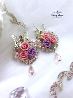 Amazing beauty and tenderness, airy wedding earrings. The earrings are decorated with different Swarovski crystals, Rhinestone crystals, pink and white artificial pearls, miniature roses from cold porcelain and silver butterflies. Undoubtedly, you will be in the spotlight, dressing in these magic earrings. This a lovely gift for bridesmaids to wear on your special day. ✿ Measurements: Size of the earrings - 6*4 cm. Silver hooks.  - Earrings handmade in silver plated, different Swarovski crystals Pierced Jewelry For Wedding On Valentine's Day, Handmade Rose Gold Bridal Earrings For Wedding, Silver Bridal Earrings For Valentine's Day Wedding, Pink Rose Design Jewelry For Wedding, Handmade Pink Bridal Earrings For Wedding, Pink Flower Earrings For Wedding On Valentine's Day, Pink Flower Earrings For Wedding And Valentine's Day, Party Drop Earrings With Rose Design, Rose Design Drop Earrings For Party