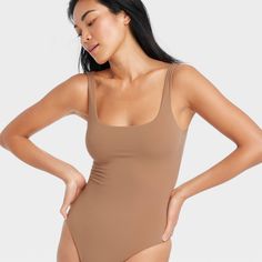 This 4-Way Stretch Tank Bodysuit from Auden™ in a solid color features a sleeveless silhouette with a breezy scoop neckline, cotton gusset for breathability and snap buttons on the crotch. Made from lightweight four-way stretch fabric it offers a comfortable fit that moves with you, and the opaque lining offers confident wear. You can wear this pullover bodysuit with everything from wide-leg trousers to joggers to shorts, and add layering pieces for versatile styling options. Auden™: Comfort tru Summer Brown Stretch Bodysuit, High-stretch Tank Bodysuit, Summer Brown Lined Bodysuit, Brown Stretch Bodysuit, Brown Sleeveless Bodysuit, Tank Bodysuit, Brown Hair With Blonde Highlights, Shipt Shopper, Bra Cups