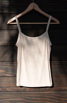 A 90's inspired elevated wardrobe essential. Made of locally sourced buttery soft upcycled rib, the Soleil is a tank top with a snugly fitting gently curved neckline, bra-friendly straps, and falls to high hip length. We consider this one true to size, and if in-between could be sized either up or down based on your preference. Made to layer - choose a pair and receive $10 off both (automatically applied at checkout). Beige Cotton Tank Top With Built-in Bra, Beige Tank Top With Built-in Bra For Loungewear, Everyday Tank Top With Built-in Bra And Minimal Stretch, Tank Top With Delicate Straps For Loungewear, Delicate Straps Tank Top For Loungewear, Loungewear Tank Top With Delicate Straps, Beige Seamless Tank Top, Seamless Fitted Tank Top With Spaghetti Straps, Everyday Tops With Tank Straps And Minimal Stretch