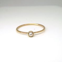 Elegant and dainty pearl ring in 14k gold filled! Perfect for your bridesmaids, graduation gift for your loved ones, or simply for yourself! They are great by themselves and are also stackable with other rings as pictured. Pearl is June birthstone What you will receive.. ONE 1mm 14K yellow gold filled ring with 3mm genuine white fresh water pearl For 14k solid gold option, please contact me!! All items are handmade with love and care in my little studio! If you have a sizing question or a specia Minimalist Pearl Ring With Single Diamond For Promise, Minimalist Pearl Promise Ring With Single Diamond, Minimalist Pearl Promise Ring With Diamond, Minimalist Pearl Drop Ring For Wedding, 14k Gold Pearl Ring With Single Diamond For Promise, Minimalist Wedding Pearl Ring With Pearl Drop, Dainty Stackable Pearl Promise Ring, Minimalist Pearl Rings With Pearl Charm, Minimalist Pearl Ring With Single Diamond