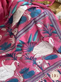 Indulge in luxury with our Kantha Stitch Saree on Bangalore Silk. This elegant pink saree is hand-stitched and made with the finest Bangalore silk, providing a delicate texture and luxurious feel. Perfect for any occasion, this saree is a must-have for those seeking sophisticated and exclusive fashion. Kantha Stitch on bangalore silk - pink Saree comes with a blouse piece. Fall and pico done. Fully stitched blouse shown in pictures is optional and can be purchased seperately from our blouses and croptops section. For saree video please connect with us on whatsapp @469-937-0606 Ready to be shipped in USA from San Diego, California. All pictures are original pictures. Colors may slightly vary due to pic resolution. Pink Raw Silk Traditional Wear With Resham Embroidery, Pink Traditional Wear With Resham Embroidery, Pink Handloom Tussar Silk Dupatta, Unstitched Pink Tussar Silk Saree, Pink Tussar Silk Saree With Zari Work, Pink Raw Silk Dupatta, Pink Raw Silk Traditional Wear For Navratri, Festive Pink Raw Silk Traditional Wear, Pink Handloom Dola Silk Saree