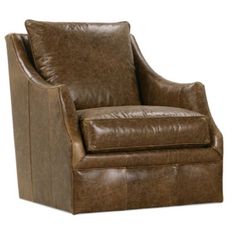 a brown leather chair sitting on top of a white floor