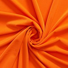 an orange fabric is shown in close up