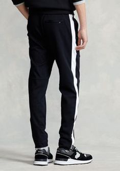 With soft cotton and vented zip hems, these sporty pants are built to keep you comfortable during workouts or weekend jaunts. | Polo Ralph Lauren Men's Soft Cotton Active Pant, Black, X-Large Sporty Fitted Jogger Pants, Fitted Sporty Joggers, Sporty Fitted Sweatpants With Tapered Legs, Relaxed Fit Joggers With Side Stripes For Jogging, Cotton Joggers With Side Stripes And Relaxed Fit, Fitted Sweatpants With Elastic Side Panels For Sports, Fitted Sportswear Bottoms With Side Stripes, Cotton Sweatpants With Side Stripes For Jogging, Fitted Sportswear Sweatpants With Elastic Side Panels