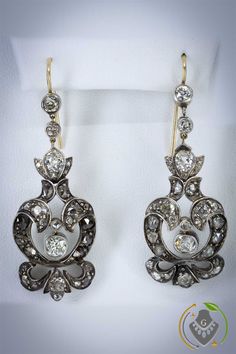 These #GeorgianEarrings are gorgeous #StatmentEarrings. #GeorgianJewelery is so rare, #DiamondEarrings of this #Vintage are especially hard to find. If you love #GeorgianJewellery these #ChandelierEarrings are a must have for your #EstateJewelery collection Visit our GrantiquesCollection Shop or ChicTiquesShop on Etsy for more fabulous Jewelry Formal Rose Cut Diamond Chandelier Earrings, Formal Chandelier Earrings With Rose Cut Diamonds, Luxury Silver Chandelier Earrings With Rose Cut Diamonds, Victorian Chandelier Earrings For Formal Occasions, Elegant Rose Cut Diamond Chandelier Dangle Earrings, Elegant Pear-shaped Earrings With Single Cut Diamonds, Elegant Pear-shaped Single Cut Diamond Earrings, Elegant Chandelier Earrings With Rose Cut Diamonds, Victorian Diamond White Earrings For Formal Events