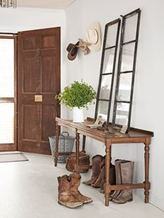 the entryway is clean and ready to be used as a place for shoes, hats, and other things