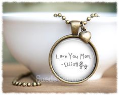 Childs Actual Artwork Necklace • Childs Drawing • Actual Handwriting Jewelry • Personalised Mum Jewelry • Necklace With Art*Those early works of art are some of the most precious (and curious) keepsakes ;) Celebrate them with this adorable necklace, created with your child's art or handwriting!🌤 Silver or antique bronze 1" (27mm) plated setting🌤 Matching heart charm (with or without)🌤 Custom image enhanced with a solid glass magnifying dome🌤 Stainless steel or bronze plated ball chain 24" (6 Personalized Artsy Jewelry For Gifts, Unique Personalized Necklace For Mother's Day, Vintage Round Necklaces For Personalized Gifts, Artistic Personalized Necklace, Artistic Personalized Round Necklace, Artistic Personalized Round Pendant Necklace, Artistic Engraved Round Pendant Necklaces, Vintage Round Necklace As Gift For Mom, Artistic Engraved Round Pendant Necklace