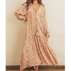 Our Mauve Blush Boho Maxi Dress Is So Flowy And Free! Boho, Ethnic Print Maxi Dress Featuring Extra Long Sleeves With Cinched Cuffs, Tiered Bottom, And Tasseled Tie At Neckline. Relaxed Fit Self & Lining 100% Rayon V-Neckline With Tie Elastic Cuffs 54” Length Model Is Wearing A Size S. S: 38” Bust M: 40” Bust L: 42” Bust Tags: Prairie Cottage Core Gunne Sax Cottagecore Retro Western Vintage Whimsical Fairycore Farm Edwardian Country Countryside Free People Anthropologie Folk Style Floral Print Maxi Dress For Beach, Long Boho Dress With Boho Print For Spring, Long Flowy Boho Dress With Print, Flowy Bohemian Boho Dress For Fall, Fall Bohemian Flowy Boho Dress, Fall Bohemian Boho Print Dress, Long Flowy Boho Print Dress, Beige Boho Dress For Fall Vacation, Flowy Boho Print Peasant Dress