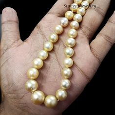 Golden South Sea Pearl Beaded Necklace, Genuine Golden South Sea Pearl Round Beads Necklace, South Sea, 7-13mm Pearl Beaded Necklace Gift        Stone - Golden South Sea Pearl Size - 7-13mm Shape - Round Color - Gold Color Necklace Strand Length - 16 Inch Yellow Pearl Necklaces With Round Beads, Round Pearl Beads For Jewelry Making, Single Strand Pearl Beaded Necklaces With Round Beads, Single Strand Pearl Beaded Necklace With Round Beads, Round Pearl Beaded Necklaces With Gemstone Beads, Pearl Beads For Jewelry Making, Pearl Beaded Necklaces With Gemstone Beads, Hand-strung Pearl Jewelry With Round Beads, Pearl Beaded Necklaces With Polished Beads