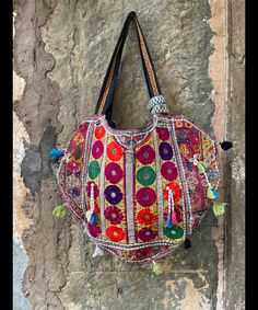 About bag  Indo-gypsy fusion, everyday use hand bag made from Banjara fabrics sourced from Vintage tribal costumes of regions of Rajastan and Gujarat. These are embellished with light catching coins, and intricate bead work tassels. Size - length 15 inches/ width 21 inches Company details:  Company name: Houseoftextile  Contact number: +919784447473  Email id: houseoftextile77@gmail.com  Shipping & custom : Delivery through one of the finest service providers : Skyway, Fedex, UPS  And DHL. Any l Embroidered Multicolor Hobo Tote Bag, Festival Embroidered Multicolor Hobo Bag, Festival Multicolor Embroidered Tote Shoulder Bag, Embroidered Hobo Tote Bag For Festival, Traditional Handmade Multicolor Hobo Bag, Traditional Multicolor Embroidered Hobo Bag, Handmade Multicolor Embroidered Hobo Bag For Festivals, Festival Multicolor Embroidered Hobo Tote Bag, Multicolor Embroidery Hobo Tote Bag For Festivals