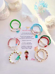 the bracelets have been decorated with beads and bead designs on them, along with an elf's message