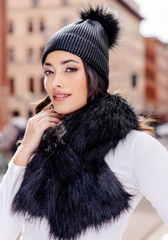 Crazy-cute and wearable, the Metallic Pom Hat is so cool, you'll wear it before the leaves fall. Why not -- in Metallic Black knit, it's stretchy and comfy. Better still, this substantial knit has recovery as well. Easy to pull on, the cap, when cuffed, measures 8" from the fur pom to the cuff fold. Ahhh, but the pièce de résistance is the oversize Black Fox pom. The magic of mixing Metallic knit with fur bestows a broad license to wear the Metallic Pom Hat with anything, everywhere. With denim, a fur jacket, or a cashmere overcoat, the Metallic Pom Hat is all in. Going to work, walking the dog, and for errands, the Metallic Pom Hat is perfect. When life happens, refresh our favorite hat with machine wash/cold/dry flat care. Soft Knit One Size Bonnet For Fall, Warm Bonnet For Fall, One Size Fits Most, One Size Knit Bonnet For Fall, Fall Soft Knit One-size Bonnet, Warm Bonnet For Fall, Cozy One Size Bonnet For Fall, Cozy One-size Bonnet For Fall, Knitted Bonnet For Fall, One Size, One Size Winter Beanie For Fall