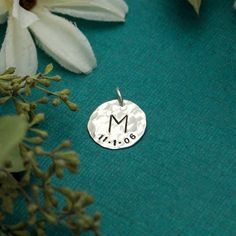 "Mother or Grandmother Charm with Initial and Birthdate Sterling Silver Hand Stamped Personalized Gift A single sterling silver hand stamped charm, 5/8\", personalized with the initial of your child with the date along the bottom edge. This item DOES NOT come with a chain. Gift jewelry necklace for mother, mom, mommy, grandmother, grandma, grandmom, mom mom, nana, nanny, grammy ----------------------------------------------------------------------------------- **Remember, when ordering list the Small Sterling Silver Writeable Gift Tag, Cheap Silver Charms For Mother's Day, Affordable Stamped Charm Necklaces For Personalized Gifts, Necklace For Mother, Remember When, Gift Jewelry, Nanny, Jewelry Necklace, Hand Stamped