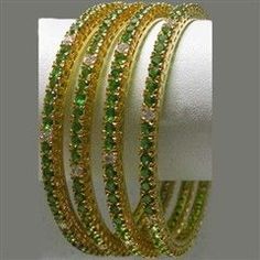 Gold Rodium Polish Gold, Green color Bangles in Metal Alloy studded with CZ Diamond Festive Round Rhinestone Jewelry, Festive Round Jewelry With Rhinestones, Green Jeweled Bangle For Party, Party Green Jeweled Bangle, Green Bling Jewelry For Wedding, Green Sparkling Wedding Jewelry, Green Rhinestone Bracelets For Wedding, Green Bangles, Cz Diamond