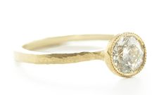 One of our best selling rings, this diamond solitaire is a classic, but never gets old. Sculpted to perfection in 18k gold, this classic looks like it could be centuries old. Inspired by the Etruscan era where metalsmithing was of mastery and the craftsman's hand always seen. Stack this gorgeous ring for a dramatic look. This 18k gold sculpted, hammered, and tapered ring features a round brilliant cut diamond accented with a single milgrain bezel. Pictured in:18k yellow gold1.11 ct white diamond Conflict Free Engagement Ring, Rhodolite Garnet Ring, Rainbow Sapphires, Rhodolite Garnet, Aquamarine Rings, Garnet Rings, White Rose Gold, Round Brilliant Cut Diamond, Brilliant Cut Diamond