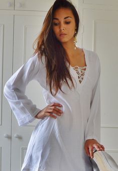 "'White Morrocan Tunic Dress - Karima's style-\" This is a vintage Moroccan Tunic dress ideal for any casual wear. Made in the traditional Moroccan tunic style, this tunic has some fabulous embroidery work. I hope you can enjoy them and be able to touch the moroccan art in your fashion. This tunic could be comfortably worn with any Jacket /Cardigan, and would look FAB with high heels,or leather boots. Could be worn with belts too Sizes: One Size (fits S-L size) Bust: 105 cm, Length: 35\" (87cm)