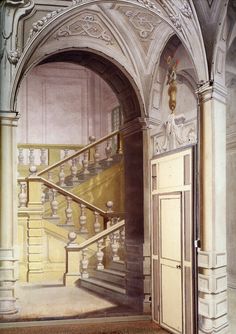 this is an image of a staircase in a building with columns and railings on either side