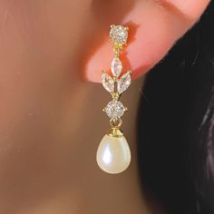 An elegant pair of pearl wedding earrings in a leaf design, adorned with freshwater pearls. These statement earrings are perfect for a bride, mother of the bride, engagement or even as a gift for her! The earrings are approx 3.2cms in length. Elegant Drop Wedding Jewelry, Elegant Pearl Earrings For Wedding, Elegant Drop Pearl Earrings For Anniversary, Classic Teardrop Earrings For Mother Of The Bride, Exquisite Pearl Drop Earrings For Anniversary, Elegant Pearl White Drop Pearl Earrings, Elegant Teardrop Earrings For Weddings, Elegant Pearl Teardrop Earrings For Anniversary, Elegant Pearl Drop Bridal Earrings