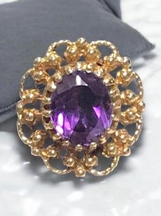 VINTAGE AMETHYST 14K YELLOW GOLD FILIGREE RING Beautifully crafted in 14k yellow gold, this 3CT Oval cut Amethyst Solitaire Ring is sure to please! This item is vintage and in excellent condition.  It is sure to be one of your favorite pieces!      Purple Vivid Hue     4.7 Grams  Shipped insured/delivery confirmation I guarantee item to be exactly as described and pictured. Antique 14k Gold Amethyst Ring, Oval Yellow Gold Estate Rings, Yellow Gold Oval Estate Rings, Estate Style 14k Gold Oval Jewelry, Estate Style Oval Yellow Gold Rings, Collectible Oval Amethyst Ring In 14k Gold, Oval Yellow Gold Rings, Victorian 14k Gold Oval Rings, Formal Oval Gold Amethyst Ring