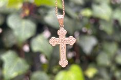 This stunning piece of religious jewelry is perfect for commemorating special moments or as a cherished gift for a loved one. Each delicate design of the floral Eastern cross is meticulously sculpted, creating a graceful and intricate pattern that catches the eye. The warm glow of the gold adds a touch of luxury, enhancing the overall allure of the pendant. 10k pendant weights approximately 1.00grams 14k pendant weights approximately 1.30grams Silver pendant weight is approximately 0.90grams  Pe Wedding Cross Pendant Necklace With Engraving, Spiritual Crucifix Jewelry For Anniversary, Spiritual Crucifix Jewelry And Charms For Anniversary, Wedding Engraved Cross Pendant Necklace, Handmade Gold Jewelry For First Communion, Handmade Cross Jewelry For Anniversary, Engraved Cross Pendant Jewelry As A Gift, Hypoallergenic Cross Jewelry Gift, Engraved Cross Pendant Necklace For Wedding