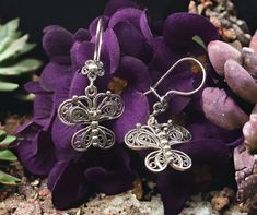 Our filigree women's earrings are made of  925 sterling silver.  Specially oxidized to achieve the authentic look. Weight; 5.4g Size: approx 4cm x 2.5cm Our company started its activities in 2019, has recently decided to open the silver jewelery which is produced highly qualified and in a unique style with the filigree technique at the local level, to the world markets and has started its activities for this purpose. Researches by archaeologists reveal that silver jewelry has been accepted as an indispensable product since ancient times. Again, researches reveal that people have produced ideas on silver jewelry and produced different techniques for jewelry making throughout history. One of the most striking of these techniques is the filigree technique. Filigree is a jewelry production tec Antique Silver Filigree Earrings As A Gift, Antique Oxidized Silver Earrings For Gift, Wife Birthday, Best Gifts For Her, Wire Wrapped Earrings, Delicate Earrings, Mom Birthday, Printed Bags, Mom Birthday Gift