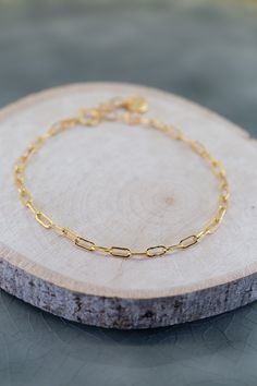 Introducing the Elements Cable Chain Gold Bracelet. This stunning bracelet is crafted from 14K gold plated brass, exuding timeless elegance. With its adjustable clasp, it offers the perfect fit for any wrist. Elevate your style with this exquisite piece that effortlessly combines sophistication and versatility. Chain Gold, Gold Gold, Metal Rings, Cable Chain, Spring Rings, Timeless Elegance, Gold Filled, Gold Bracelet, Gold Plate