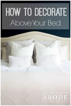 a bed with white pillows and the words how to decorate above it in black text