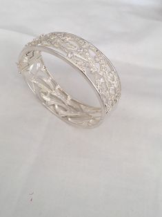 "Amazing Branch Wave Openwork Wide Hinged Bangle Beacelet Front Design Has Cubic Zirconia Stones 925 Sterling Silver Weighs 55 Grams Outside length 2.87\" x 2.38\" Width - 0.87\" New old stock Beautiful new bracelet Visit our shops on Etsy HauteCoutureLaLa TrendsCouture BeautifulPatina LastingTrends Combine shipping within first three shops listedFree Shipping on orders over $35.00 however if there is a return buyer to refund seller for the free shipping cost to seller. BeautifulPatinaFree shipp Sterling Silver Bracelet With Sparkling Stones For Wedding, Silver Cubic Zirconia Crystal Bracelet Fine Jewelry, Silver Cubic Zirconia Crystal Bracelet, Silver Bracelets With Sparkling Stones For Anniversary, Anniversary Silver Bracelets With Sparkling Stones, Silver Crystal Bracelet With Sparkling Stones, Sterling Silver Bangle With Sparkling Stones, Silver Cuff Bracelet With Diamond Accents, Silver Bangle Jewelry With Sparkling Stones