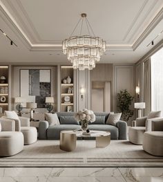 a living room filled with lots of furniture and a chandelier hanging from the ceiling