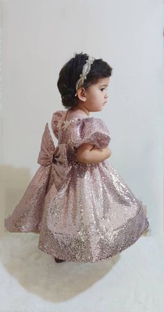 Your little one will be the most beautiful princess in this sparkly puffy dress! Elegant Pink Princess Dress For Festive Occasions, Glitter Tulle Dress With Sequins For Party Season, Party Season Glitter Tulle Dress With Sequins, Party Season Dresses With Sequins On Glitter Tulle, Party Season Dresses With Sequins And Glitter Tulle, Princess Style Glitter Dress For Dress-up, Gold Princess Dress For Holidays, Elegant Festive Dress With Glitter Tulle, Gold Glitter Tulle Dress For Dress-up