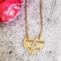 "Celebrate your friendship with this funny jewelry set for two! These are TWO beautiful broken heart necklaces hand-stamped as one with the phrase, \"PARTNERS IN CRIME\" in uppercase or lowercase font of your choice. When the necklaces are apart, the message on the full necklace isn't clear -- which is great for those of us who love to laugh at ourselves. Show your appreciation for your ride or die, partner in crime! This pair of accessories is a fantastic gift for your best friend for their bir Couples' Heart Charm Jewelry For Valentine's Day, Customized Jewelry For Valentine's Day Friendship, Customized Jewelry For Friendship On Valentine's Day, Valentine's Day Couples Jewelry With Heart Charm, Couples' Valentine's Day Jewelry With Heart Charm, Valentine's Day Jewelry With Heart Charm, Meaningful Nickel-free Jewelry For Best Friend Gift, Meaningful Nickel-free Jewelry For Best Friend, Meaningful Nickel Free Jewelry For Best Friend