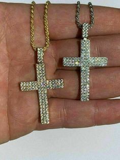 Gorgeous cross pendant!
SUPER ICY!
REAL solid 925 sterling silver...never turns green
This is a lifetime piece
We have 3 styles! Rhodium finished, Two-toned, & 14k yellow gold finished!
Color lasts many years
 
Measures roughly 1" by 1.5" (2" w. bale) ..weighs roughly 7 grams
Not too big and gaudy yet not too small so very noticeable
100 prong set handset man made diamonds (CZ) for a total of 1ct!
 
SO ICY IT WILL BLIND YOU!
100% 925 silver...not plated or fille Silver Pendant Jewelry With Bling, Silver Bling Pendant Jewelry, Silver Diamond Cut Pendant Cross Necklace, Gold Cross Necklace With Silver Chain, White Gold Cross Jewelry For Spiritual Style, White Gold Bling Cross Jewelry, Spiritual White Gold Cross Jewelry, Gold Jewelry With Silver Chain And Cross Shape, Sterling Silver Bling Pendant Jewelry