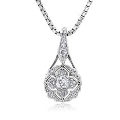 This is part of Chairish’s Fine Jewelry assortment.  Introducing the exquisite Art Deco Floral Diamond Pendant Necklace—a true embodiment of timeless elegance and sophistication. Crafted with meticulous attention to detail, this captivating piece showcases a dazzling 0.55 carat diamond set in a lustrous 18-karat white gold setting. The pendant's design draws inspiration from the Art Deco era, characterized by its geometric patterns and intricate motifs. The centerpiece of this necklace features Exquisite Oval Necklace With Single Cut Diamonds, Exquisite Platinum Necklace With Single Cut Diamonds, Exquisite Diamond Cut Necklace In Diamond White, Refined Silver Necklace With Single Cut Diamonds, Elegant Teardrop Pendant Diamond Necklace For Anniversary, Refined Wedding Pendant Jewelry, Exquisite Diamond Necklace With Intricate Design, Elegant Diamond Teardrop Pendant Necklace, Elegant Teardrop Diamond Necklace