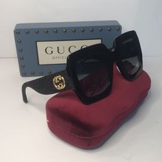 Gucci Square Frame Glitter Gg0102s Sunglasses Black This Is An Authentic Pair Of Gucci Square Frame Glitter Gg0102s Sunglasses In Black. These Bold Sunglasses Have Black Acetate Oversized Square Frames With Gradient Dark Gray Lenses. The Arms Are Black Glitter And Feature A Gold Gg Logo At The Temple. Size Length: 5.75 In Height: 2.75 In Width: 5.75 In Comes With Gucci Authentic Case Maybe Different Color From Pictures Gucci Authentic Cleaning Clothe Gucci Authentic Dust Bag Gucci Authentic Card Gucci Sunglasses Women, Bold Sunglasses, Gucci Cat Eye Sunglasses, Circular Sunglasses, Gucci Glasses, Sunglasses Women Oversized, Gray Lenses, Grey Sunglasses, Plastic Sunglasses