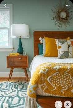 a bed room with a neatly made bed and a night stand