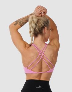 This Twisted Sports Bra combines style and performance. Crafted to make you feel secure and look stunning. It's like a second skin that never rides up, giving you the freedom to move. The stretchy fabric gives you freedom to move, while the moisture-wicking feature ensures you stay fresh. Feel confident and supported with the intricate strap design. Whether you're lifting weights or stretching, this top is your go-to for any activity. Grab yours and feel the difference! Model: Samantha wears bra Gym Sports Bra With Built-in Padding And Stretch, Supportive Activewear With Built-in Padding For Light Sports, High Stretch Sports Bra With Built-in Padding For Training, Fitted Nylon Sports Bra With Strappy Back, Supportive Pink Activewear With Built-in Padding, Sporty Strappy Activewear With Built-in Padding, Light Support Micro-elastic Activewear For Training, Micro-elastic Squat Proof Activewear For Sports, Cross Back Sports Bra With Mesh Detail