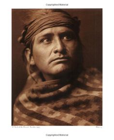 an old black and white photo of a man with a bandana on his head