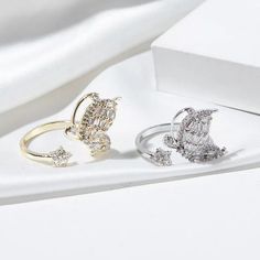 Luxurious And Elegant Our Zircon Butterfly Rings are designed with sophistication in mind. Open design to adjust to any size finger, made with Cubic Zirconia Diamonds to add that sparkle. Gold Opening Rings, CZ Butterfly Rings, Butterfly Ring Silver Butterfly Ring For Parties, Adjustable Rings With Sparkling Stones For Party, Adjustable Dazzling Diamond Crystal Ring, Adjustable Crystal Gold Rings, Crystal Open Ring As Gift, Adjustable Sparkling Rings For Wedding, Crystal Open Ring Gift, Crystal Open Ring For Gift, Adjustable Fine Jewelry Rings For Party