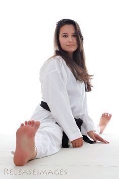 a woman sitting on the floor with her feet up