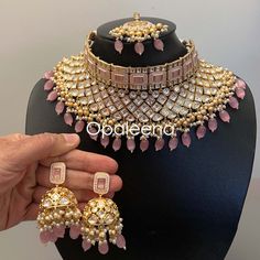 Stylish bridal kundan choker soft baby pink choker set kundan polki jewellery set baby pink meenakari set Indian jewelry set trendy chic choker set Perfect gift for Christmas. Length of the choker: 10.3 cms  Width of the choker: 27.3 cms  Length of the earrings: 9.4 cms  Width of the earrings: 3.3 cms  Length of the maang tikka: 17.3 cms  Width of maang tikka: 3.3 cms  Weight: 240 grams GIFT / PERSONALISED MESSAGE: Please provide the message within the NOTE TO SELLER section if you want to send Light Pink Jewelry, Pink Choker Necklace, Wedding Choker Necklace, Indian Jewelry Set, Kundan Choker Set, Pink Jewelry Set, Kundan Jewellery Set, Pink Choker, Kundan Choker