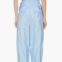 Isabel Marant Olga Sporty Nylon & Silk Pants Size 6 Us / 38 Fr Color: Light Blue Bnwot - Never Worn Parachute Pants Drop Back In To Today's Couture Via This High-Waisted Pair Cut In A Nylon And Silk Blend With Billowed Legs And Zipped Elasticized Cuffs. 28" Waist Hips: Approx 48" 28" Inseam Approx 17" Front Rise Approx 18" Back Rise Zip Fly With Two-Snap Closure Adjustable Side Tabs Front Slant Pockets; Back Zip-Patch Pockets Elastic Cuffs With Zip Closures 65% Polyamide, 35% Silk Dry Clean Silk Pants, Isabel Marant, Color Light, Snap Closure, Parachute Pants, Pant Jumpsuit, Light Blue, Pants For Women, Dry Clean