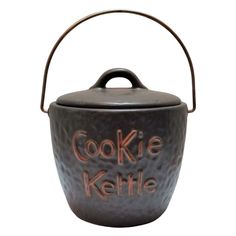 a cookie kettle with the words cookie kettle painted on it's front and side